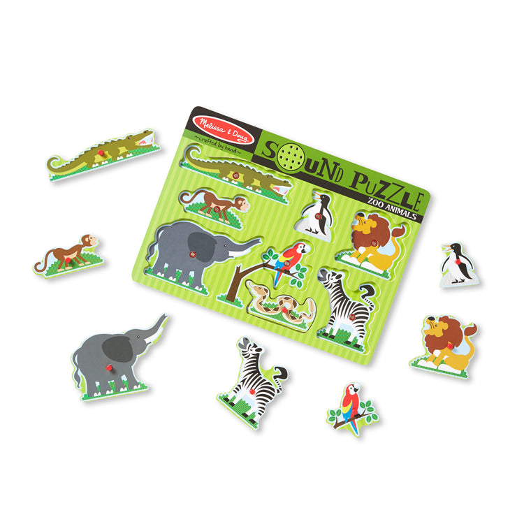 The loose pieces of The Melissa & Doug Zoo Animals Sound Puzzle - Wooden Peg Puzzle With Sound Effects (8 pcs)