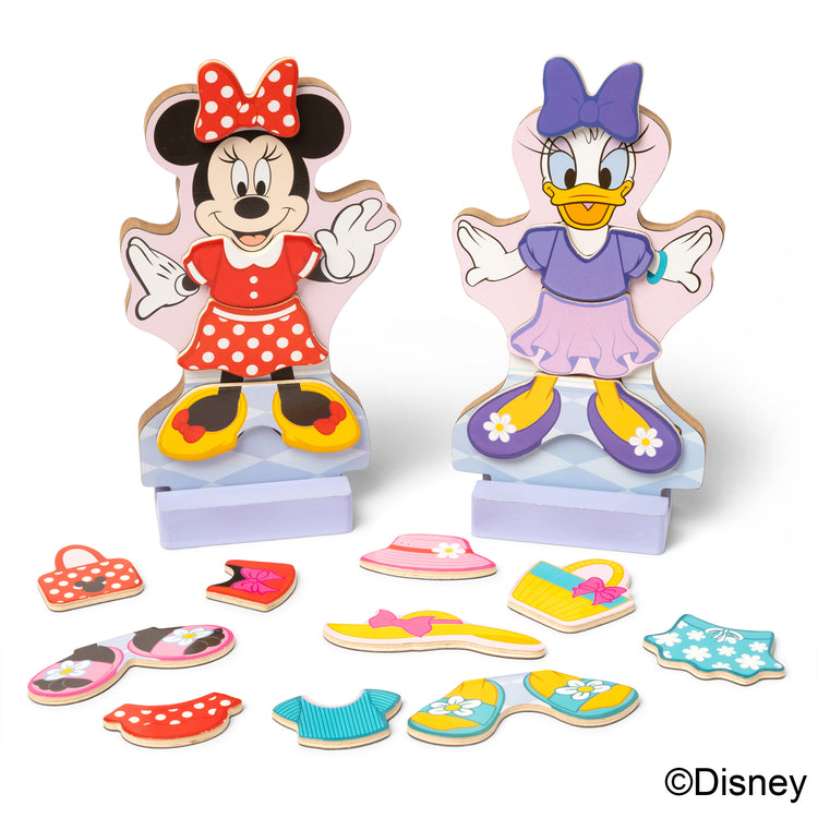The loose pieces of The Melissa & Doug Disney Minnie Mouse and Daisy Duck Deluxe Wooden Magnetic Dress-Up; 2 Fashion Dolls with Stands for Pretend Play, 52 Pieces