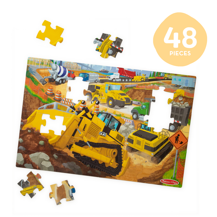 A kid playing with The Melissa & Doug Building Site, Construction Themed Jumbo Floor Puzzle, 48‑Piece Construction Vehicle Jigsaw Puzzle, 3 x 2 Foot Toddler Puzzles for Kids Ages 3+
