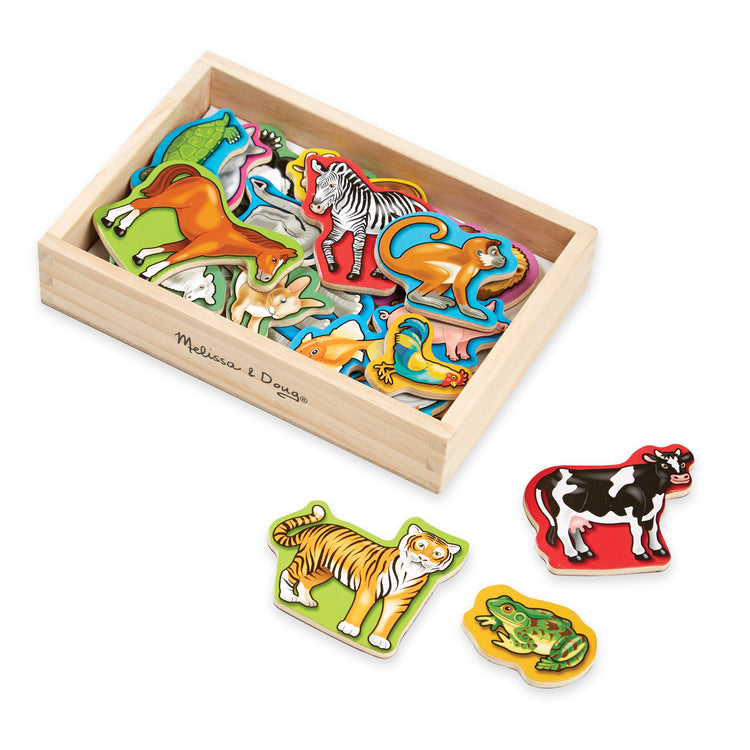 The loose pieces of The Melissa & Doug 20 Wooden Animal Magnets in a Box