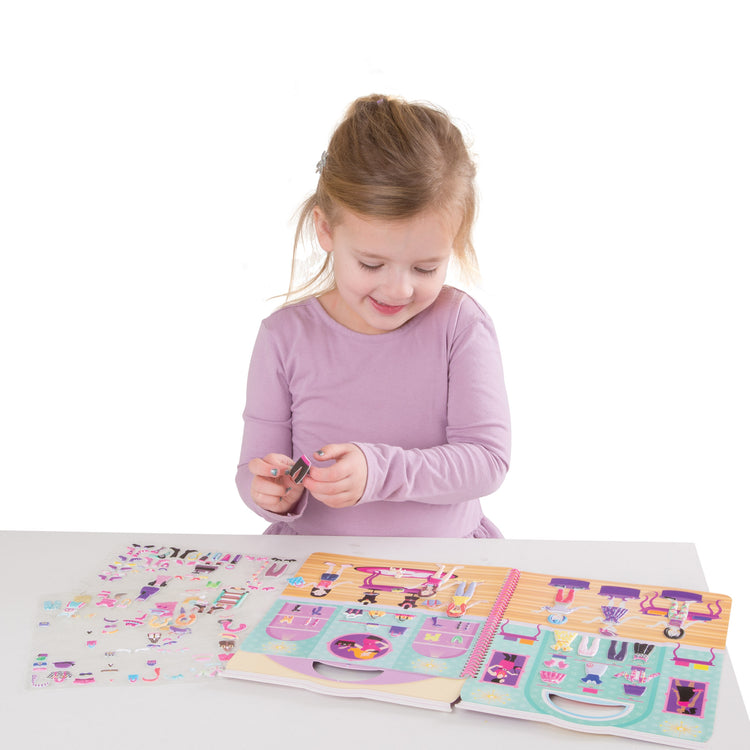 A child on white background with The Melissa & Doug Puffy Sticker Activity Book: Day of Glamour - 196 Reusable Stickers