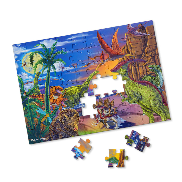 The loose pieces of The Melissa & Doug Land of Dinosaurs Jigsaw Puzzle (60 pcs)