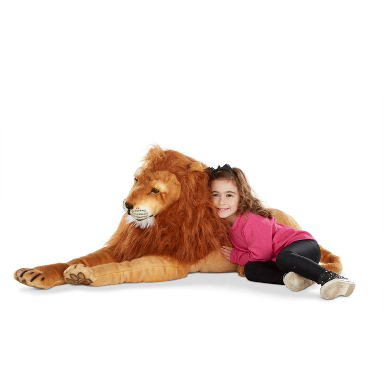 A child on white background with The Melissa & Doug Giant Lion - Lifelike Stuffed Animal (over 6 feet long)
