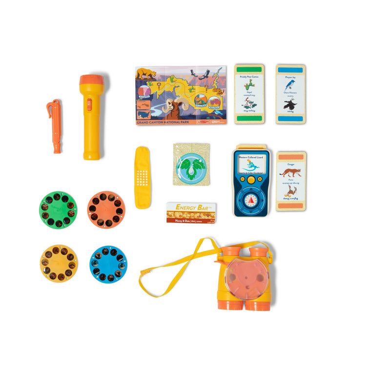 The loose pieces of The Melissa & Doug Grand Canyon National Park Hiking Gear Play Set with Photo Disk Viewer
