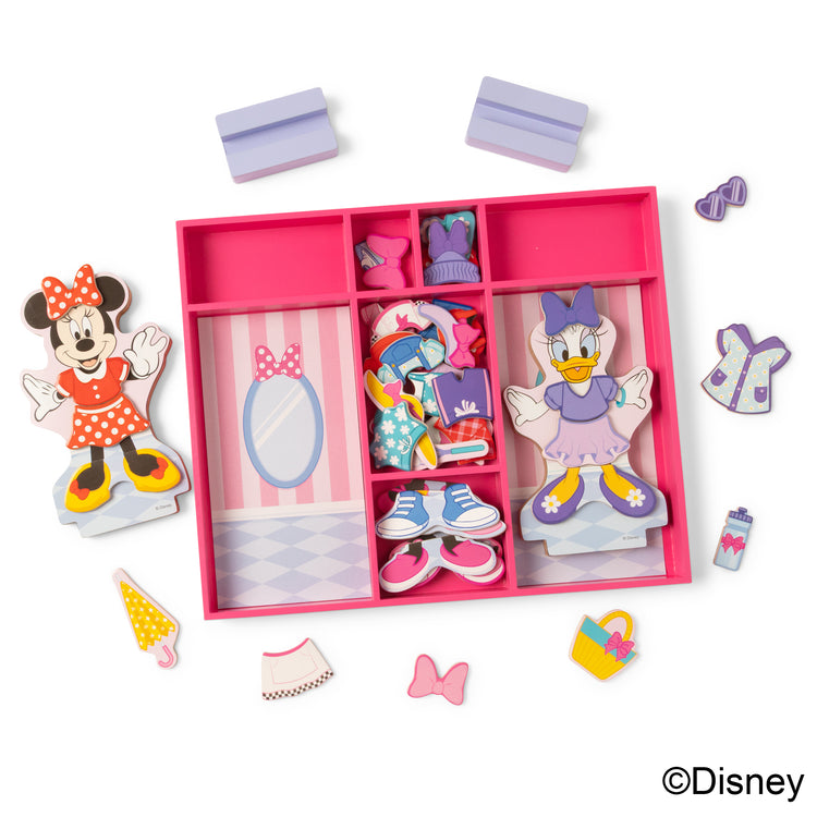 The loose pieces of The Melissa & Doug Disney Minnie Mouse and Daisy Duck Deluxe Wooden Magnetic Dress-Up; 2 Fashion Dolls with Stands for Pretend Play, 52 Pieces