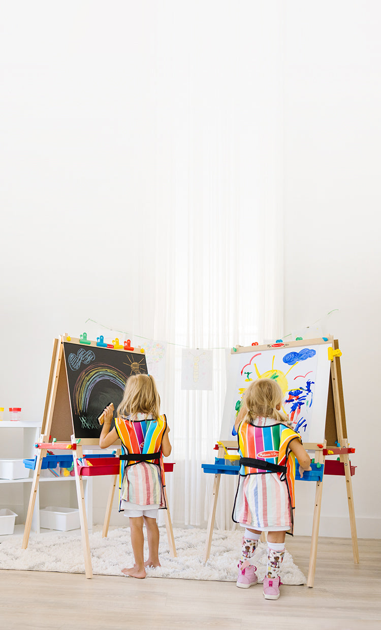 Kids playing with deluxe wooden standing art easels