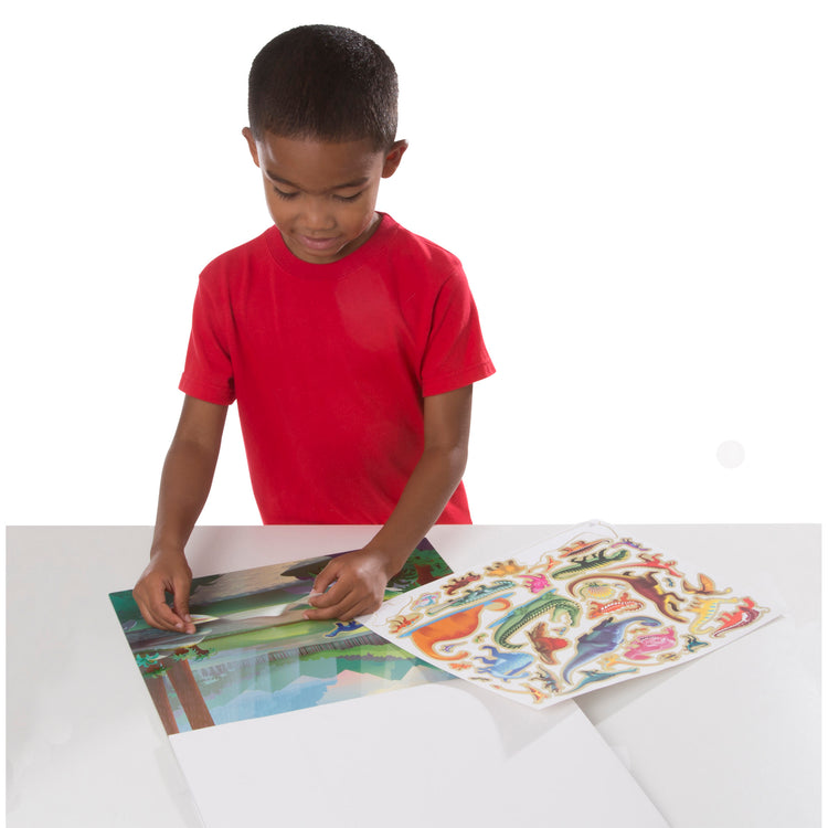 A child on white background with The Melissa & Doug Reusable Sticker Pad - Prehistoric