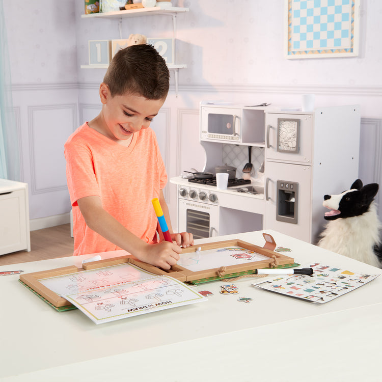A kid playing with The Melissa & Doug Natural Play: Play, Draw, Create Reusable Drawing & Magnet Kit – Farm (38 Magnets, 5 Dry-Erase Markers)