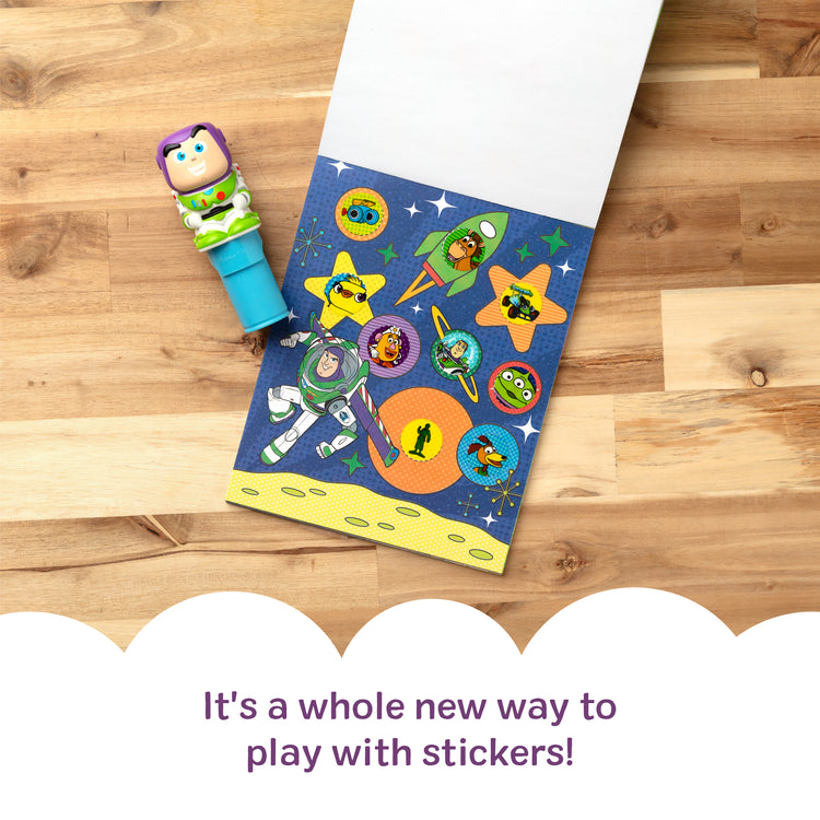 A kid playing with The Melissa & Doug Sticker Wow!™ 24-Page Activity Pad and Sticker Stamper, 300 Stickers, Arts and Crafts Fidget Toy Collectible Character – Disney Buzz Lightyear - for Kids Ages 3+