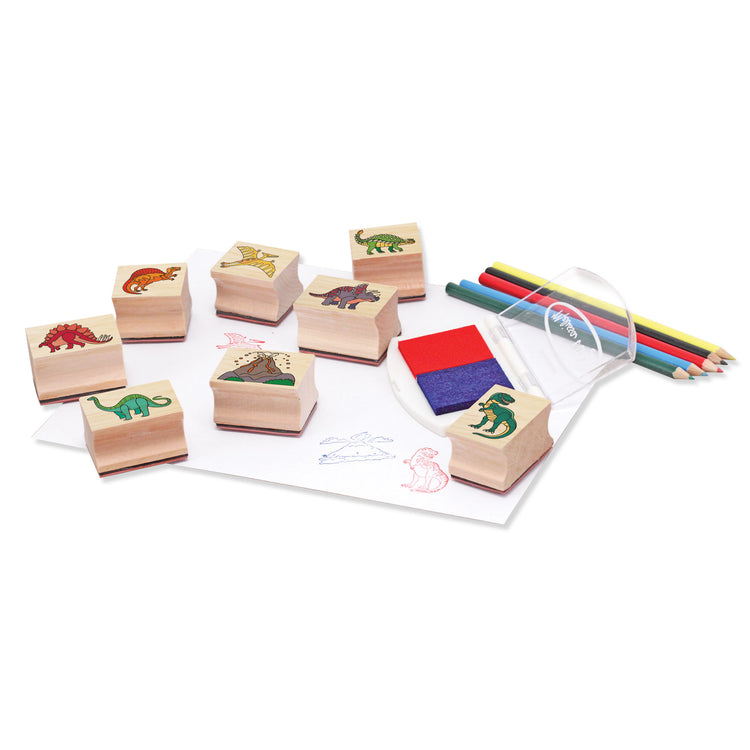 The loose pieces of The Melissa & Doug Wooden Stamp Set: Dinosaurs - 8 Stamps, 5 Colored Pencils, 2-Color Stamp Pad