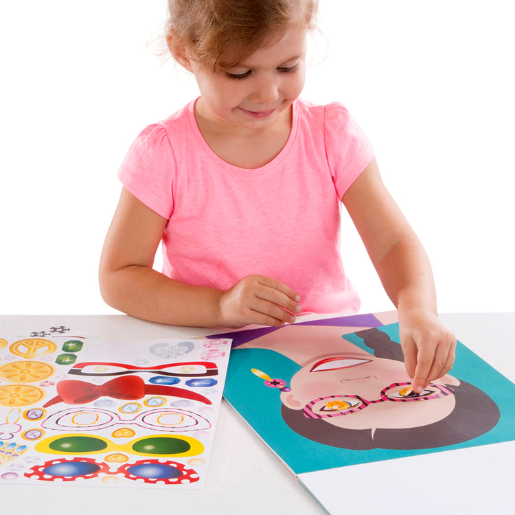A child on white background with The Melissa & Doug Make-a-Face Sticker Pad - Fashion Faces, 20 Faces, 5 Sticker Sheets