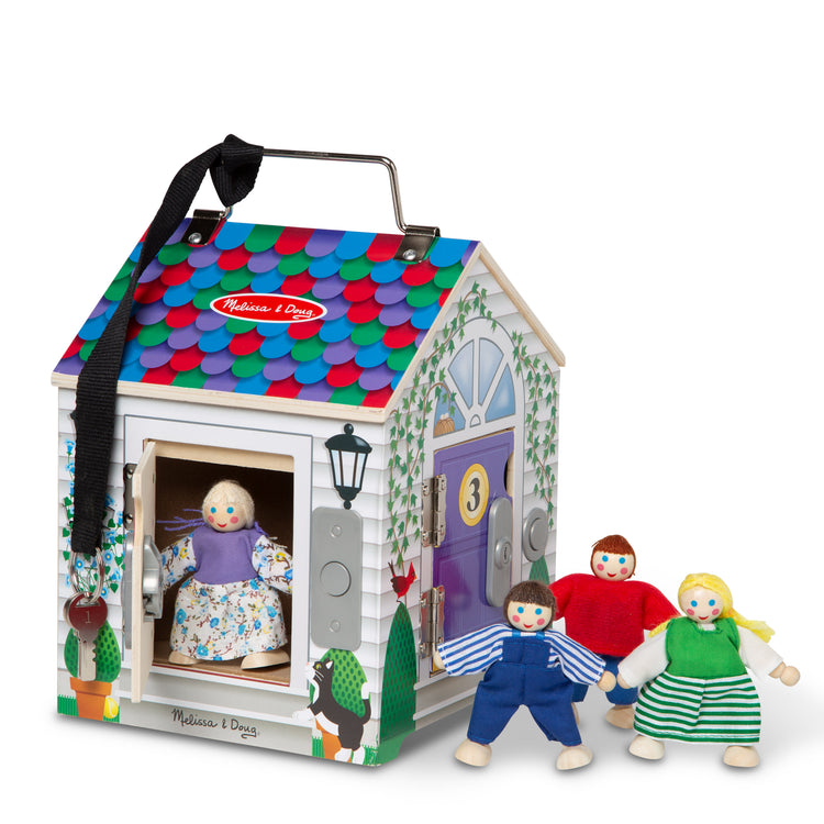 The loose pieces of The Melissa & Doug Take-Along Wooden Doorbell Dollhouse - Doorbell Sounds, Keys, 4 Poseable Wooden Dolls