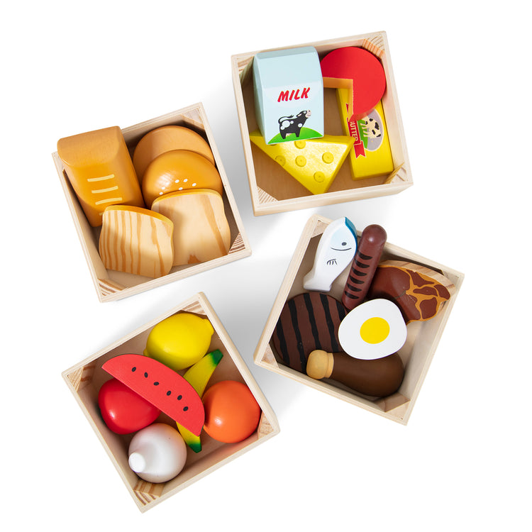 The loose pieces of The Melissa & Doug Food Groups - 21 Wooden Pieces and 4 Crates, Multi
