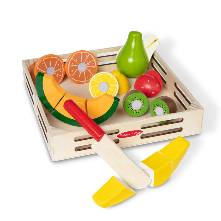 The loose pieces of The Melissa & Doug Cutting Fruit Set - Wooden Play Food Kitchen Accessory, Multi