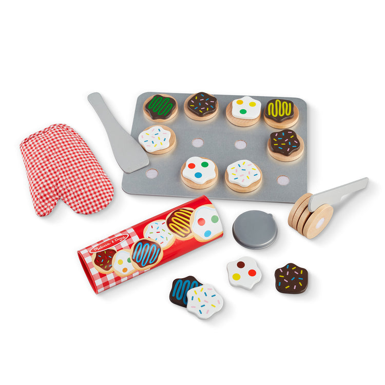 The loose pieces of The Melissa & Doug Slice and Bake Wooden Cookie Play Food Set