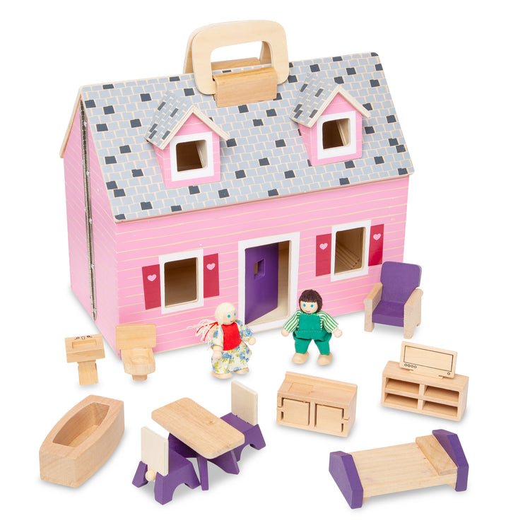 The loose pieces of The Melissa & Doug Fold and Go Wooden Dollhouse With 2 Dolls and Wooden Furniture