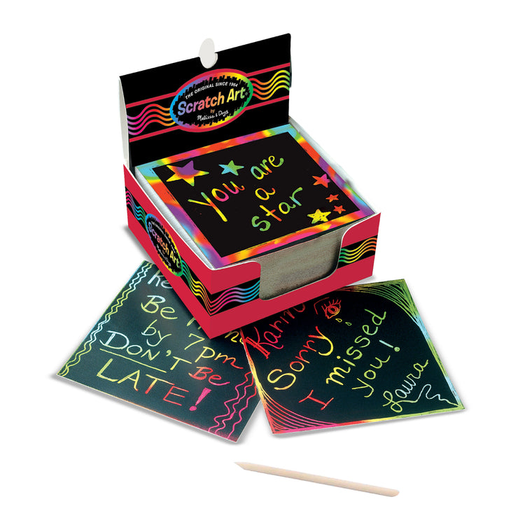 The loose pieces of The Melissa & Doug Scratch Art Rainbow Mini Notes (125) With Wooden Stylus