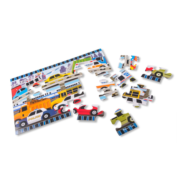 The loose pieces of The Melissa & Doug Traffic Jam Jumbo Jigsaw Floor Puzzle (24 pcs, 2 x 3 feet long)