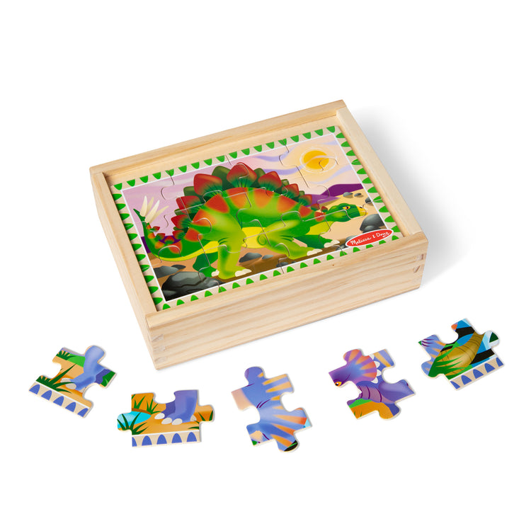 The loose pieces of The Melissa & Doug Dinosaurs 4-in-1 Wooden Jigsaw Puzzles in a Storage Box (48 pcs)