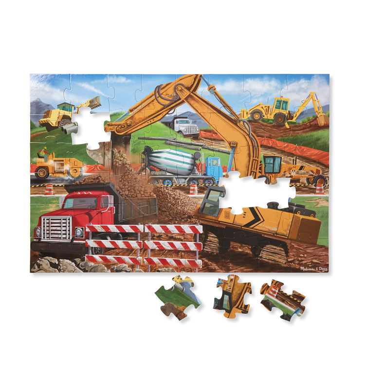 The loose pieces of The Melissa & Doug Building Site Jumbo Jigsaw Floor Puzzle - 48 pcs