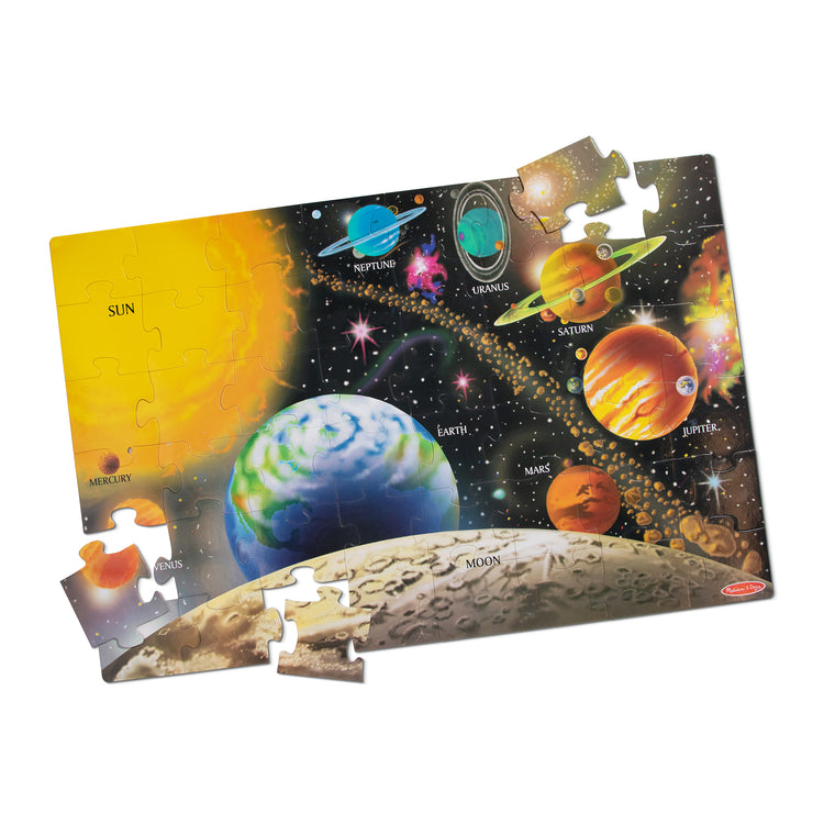 The loose pieces of The Melissa & Doug Solar System Floor Puzzle (48 pcs, 2 x 3 Feet)