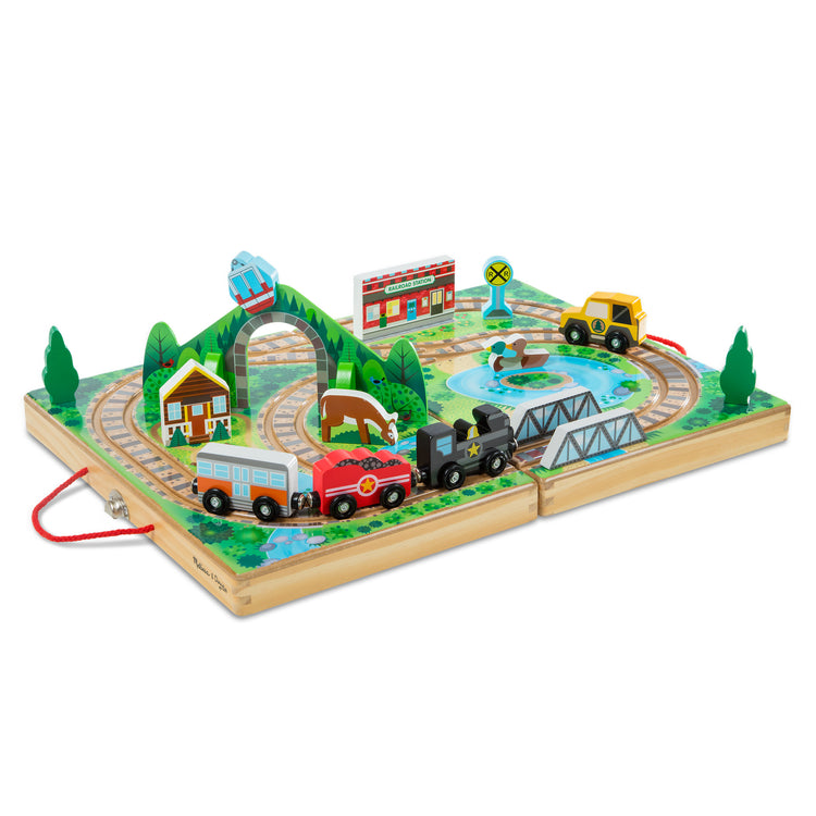 The loose pieces of The Melissa & Doug 17-Piece Wooden Take-Along Tabletop Railroad, 3 Trains, Truck, Play Pieces, Bridge