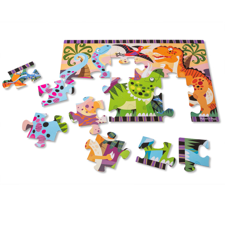 The loose pieces of The Melissa & Doug Dinosaur Dawn Jumbo Jigsaw Floor Puzzle (24 pcs, 2 x 3 feet)