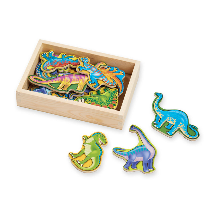 The loose pieces of The Melissa & Doug Magnetic Wooden Dinosaurs in a Wooden Storage Box (20 pcs)
