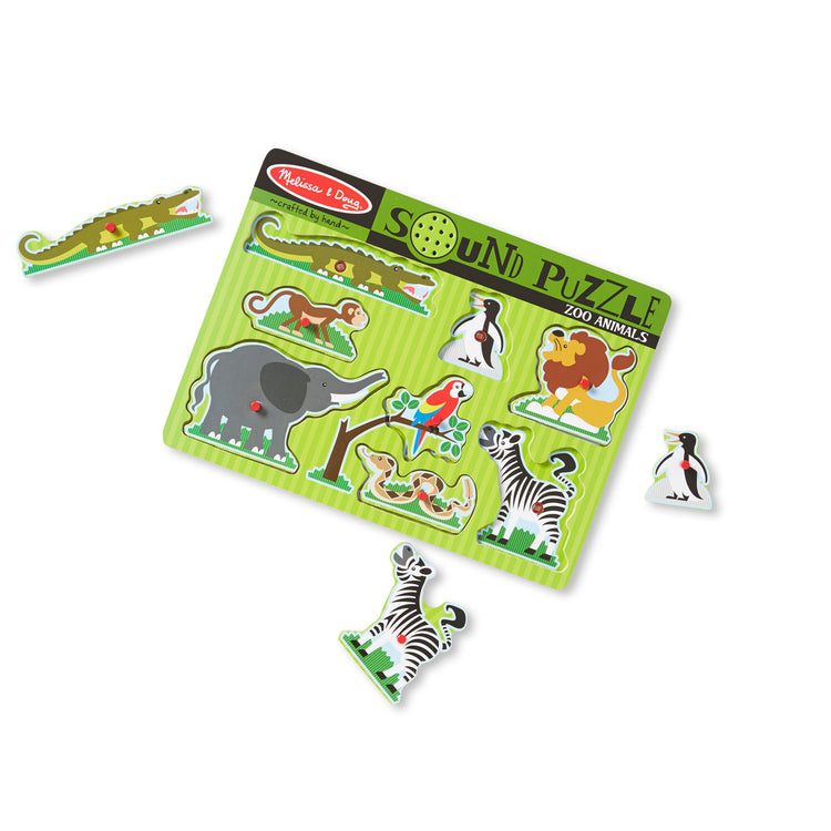 The loose pieces of The Melissa & Doug Zoo Animals Sound Puzzle - Wooden Peg Puzzle With Sound Effects (8 pcs)