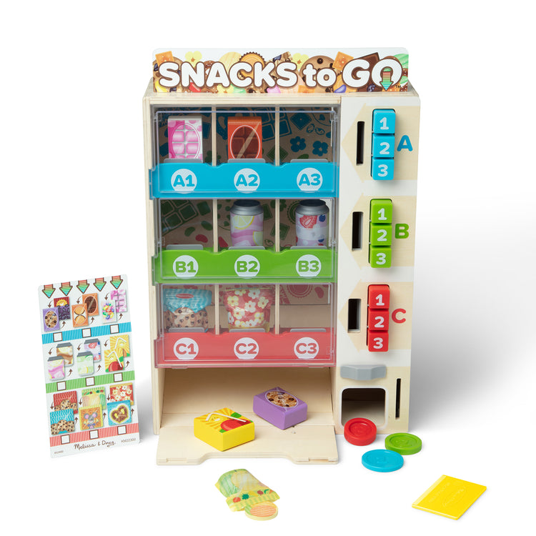 The loose pieces of The Melissa & Doug Sort, Stock, Select Wooden Vending Machine Play Set, Wooden Toy Play Food For Boys and For Girls 3+
