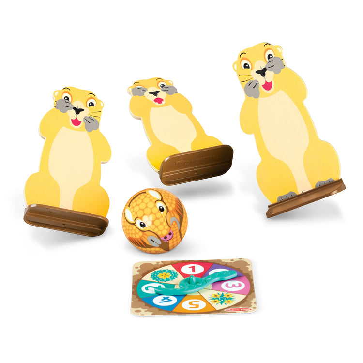 The loose pieces of The Melissa & Doug Fun at the Fair! Wooden Armadillo Roll & Bowl Prairie Dog Bowling Game