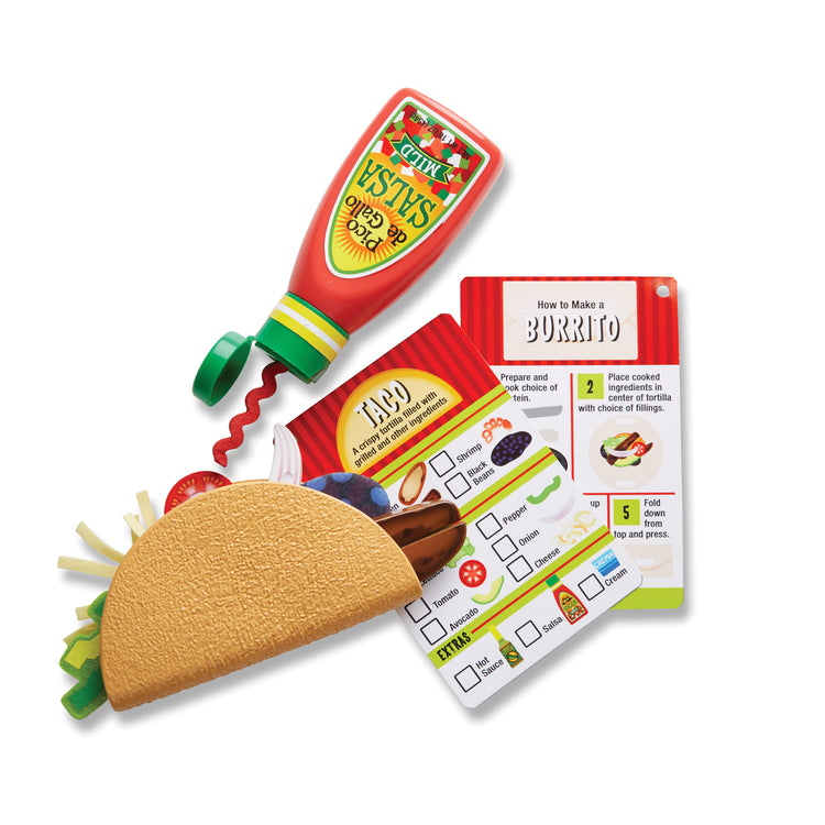 The loose pieces of The Melissa & Doug Fill & Fold Taco & Tortilla Set, 43 Pieces – Sliceable Wooden Mexican Play Food, Skillet, and More