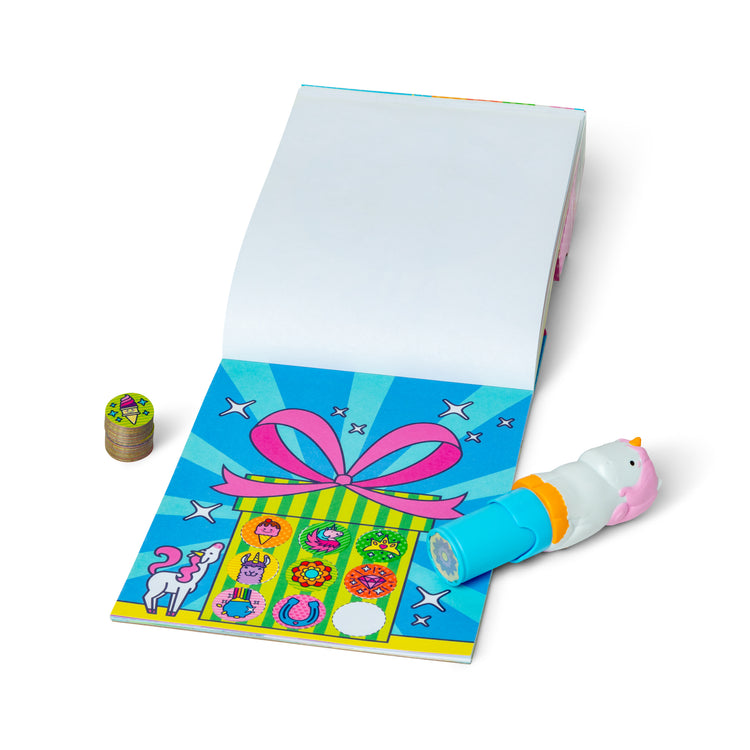 The loose pieces of The Melissa & Doug Sticker WOW!™ Unicorn Bundle: Sticker Stamper, 24-Page Activity Pad, 600 Total Stickers, Arts and Crafts Fidget Toy Collectible Character