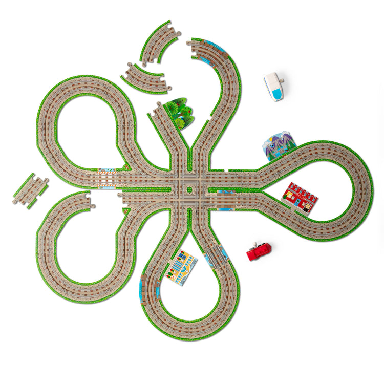The loose pieces of The Melissa & Doug Design Your Own Railroad 48-Piece Floor Puzzle with 2 Wind-up Toy Trains and Interchangeable Scenery, Kids Puzzles with Preschool Toys for Girls & Boys Ages 4 and Up