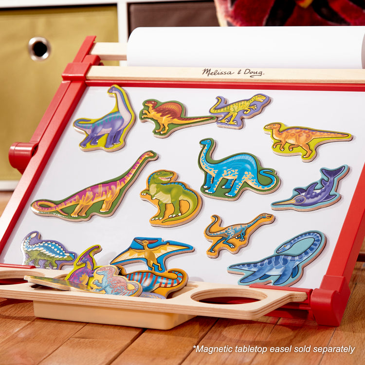 A playroom scene with The Melissa & Doug Magnetic Wooden Dinosaurs in a Wooden Storage Box (20 pcs)