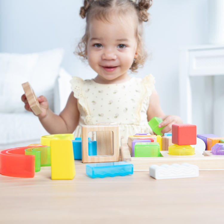 A kid playing with The Sensory Matching Blocks
