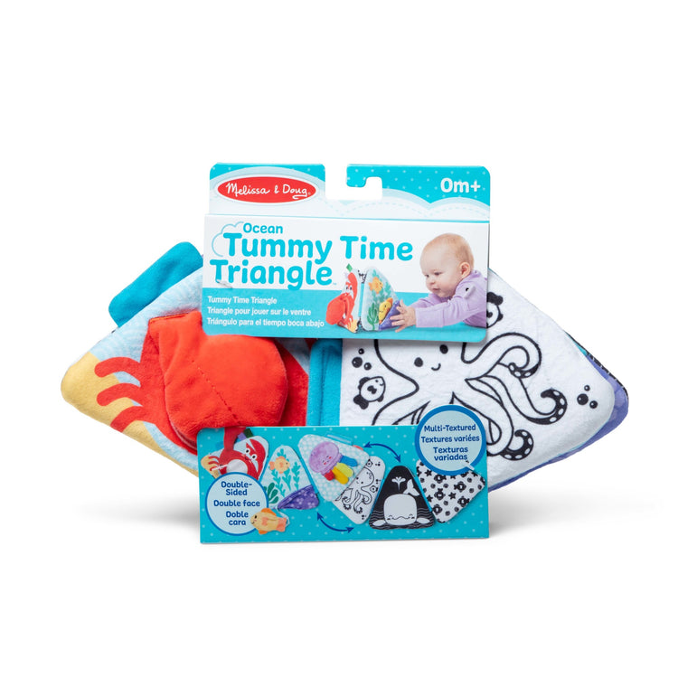 The front of the box for The Melissa & Doug Ocean Tummy Time Triangle Infant Baby Toy, Soft Sensory Toy with Textures, Mirror, Floor Toy for Newborns to Ages 6 Months
