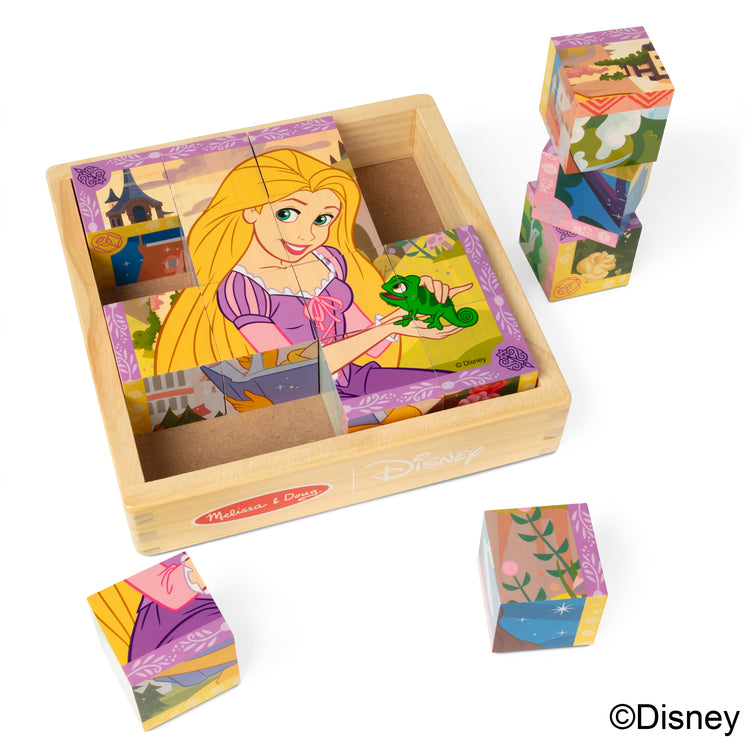 The loose pieces of The Melissa & Doug Disney Princess Wooden Toy Cube Puzzle Blocks for Boys and for Girls 3+