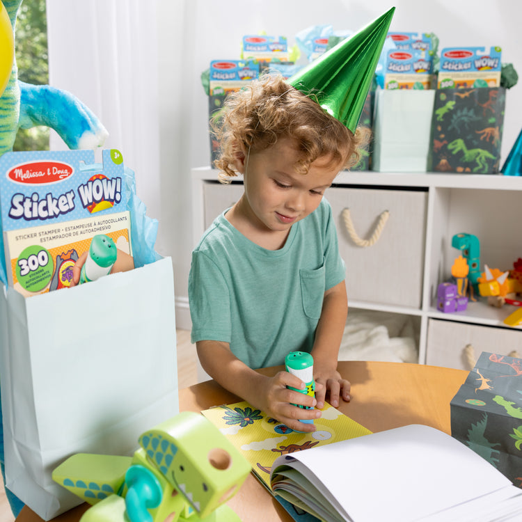 A kid playing with The Melissa & Doug Sticker WOW!™ 24-Page Activity Pad and Sticker Stamper, 300 Stickers, Arts and Crafts Fidget Toy Collectible Character – Dinosaur