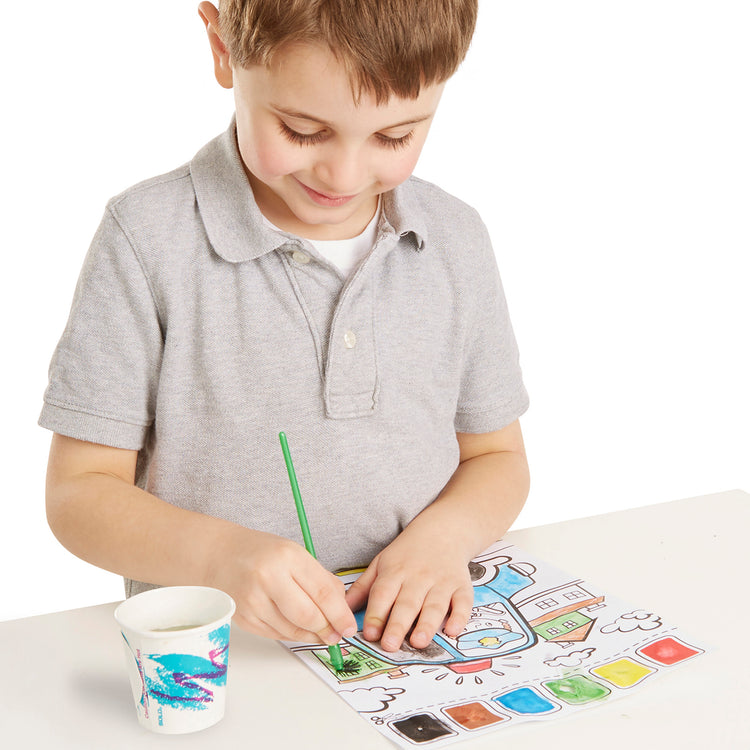 A child on white background with The Melissa & Doug Paint With Water - Vehicles, 20 Perforated Pages With Spillproof Palettes