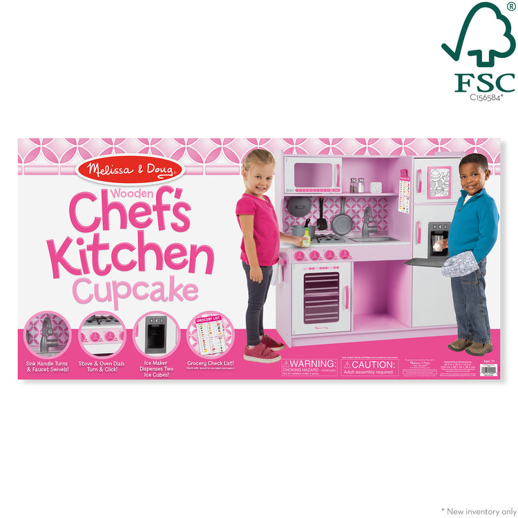 The front of the box for The Melissa & Doug Wooden Chef’s Pretend Play Toy Kitchen With “Ice” Cube Dispenser – Cupcake Pink/White