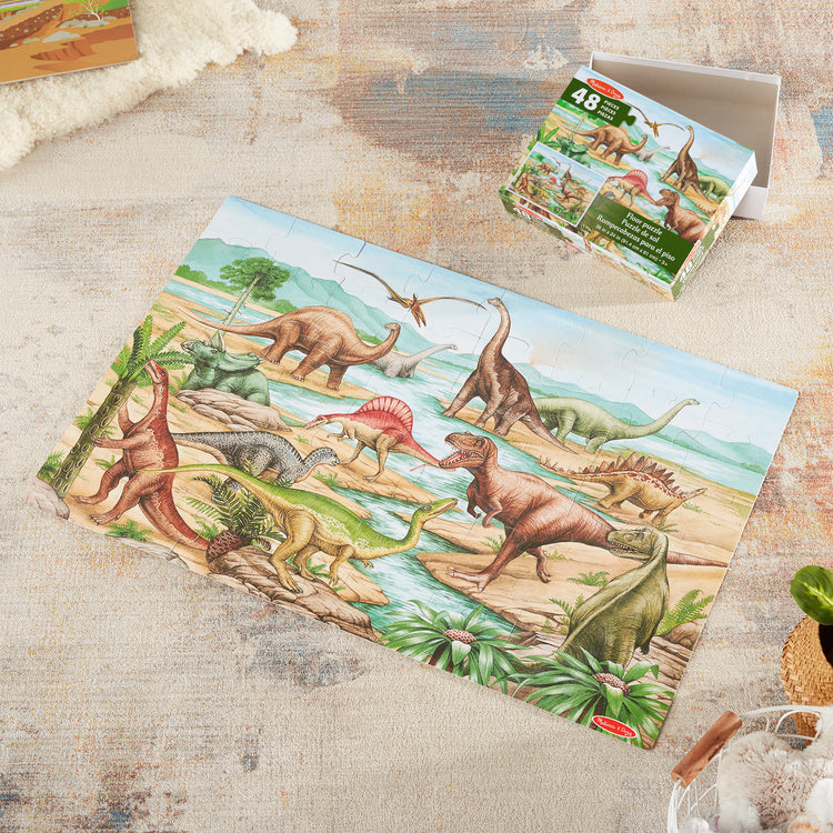 A playroom scene with The Melissa & Doug Dinosaurs Floor Puzzle - 48 Pieces (2 Feet x 3 Feet Assembled)