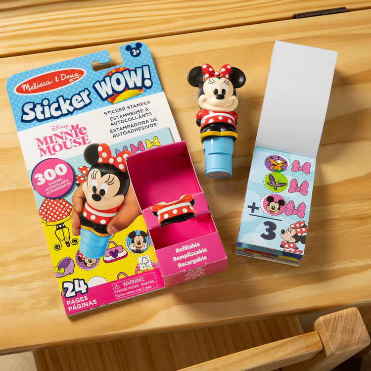 A playroom scene with The Melissa & Doug Sticker WOW!™ Disney Minnie Mouse Bundle: 24-Page Activity Pad, Sticker Stamper, 500 Stickers, Mini Pad, Arts and Crafts Fidget Toy Collectible Character