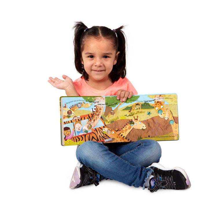 A child on white background with The Melissa & Doug Children's Book - Poke-a-Dot: The Wheels on the Bus Wild Safari (Board Book with Buttons to Pop)