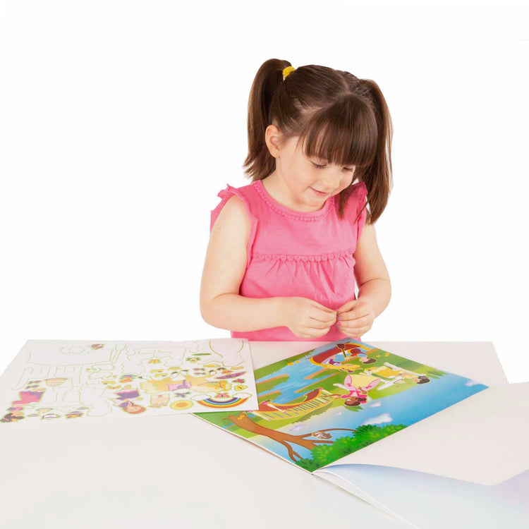 A child on white background with The Melissa & Doug Reusable Sticker Pad: Princess Castle - 200+ Stickers and 5 Scenes