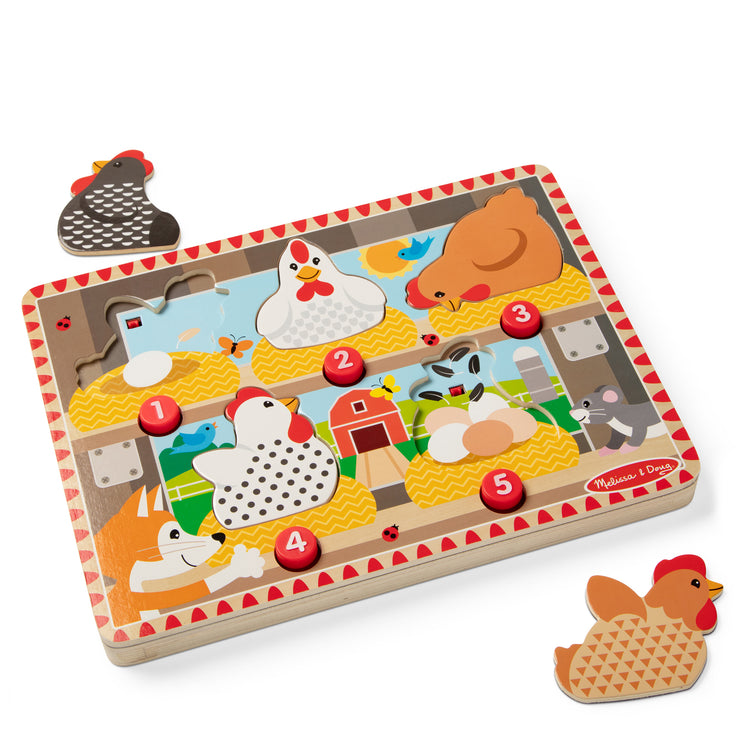 The loose pieces of The Happy Hens Push to Pop Puzzle
