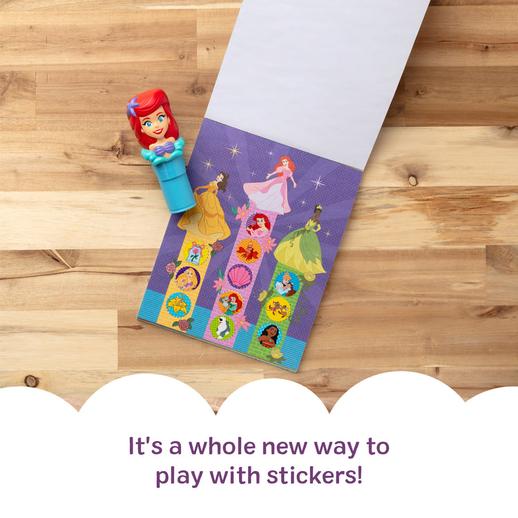 A kid playing with The Melissa & Doug Sticker Wow!™ 24-Page Activity Pad and Sticker Stamper, 300 Stickers, Arts and Crafts Fidget Toy Collectible Character – Disney Princess Ariel - for Kids Ages 3+