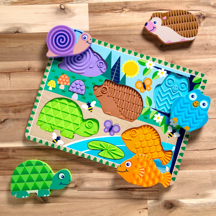A playroom scene with The Forest Friends Touch & Feel Puzzle