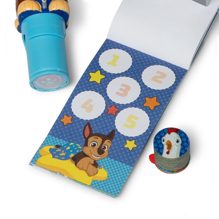 The loose pieces of The Melissa & Doug Sticker WOW!™ Mini Activity Pad and 200+ Refill Stickers for Sticker Stamper Arts and Crafts Fidget Toy Collectibles – PAW Patrol Stickers