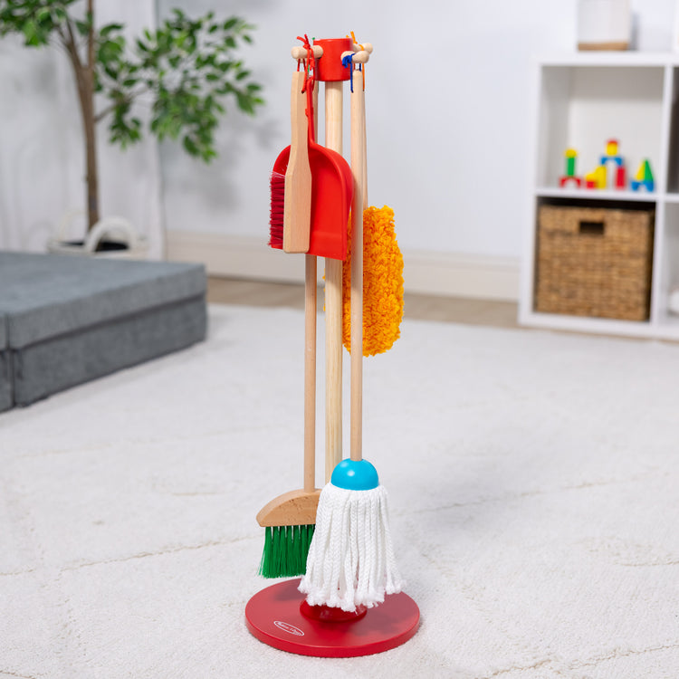 A playroom scene with The Melissa & Doug Dust! Sweep! Mop! 6-Piece Pretend Play Cleaning Set